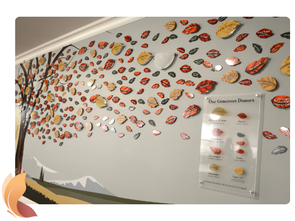 Wall mural of a tree with various fall coloured leaves and a plaque that reads - Our Generous Donors