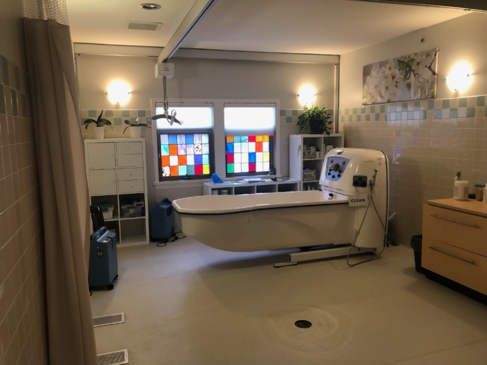 Personal care room with tub and stained glass windows