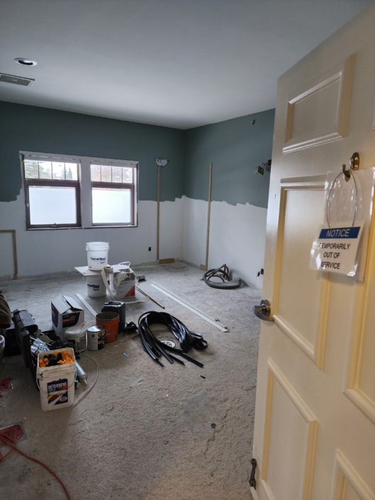 Room in the middle of renovation with construction materials on ground